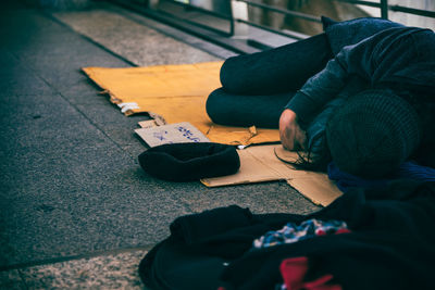 Low section of person sitting on floor