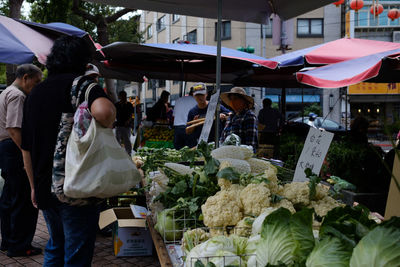 People at market stall