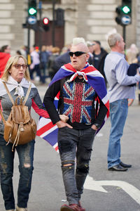 Group of people walking on street