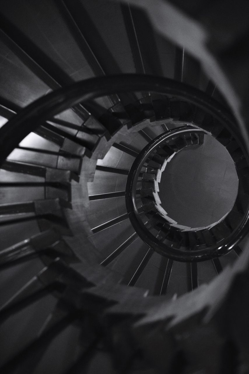 steps and staircases, staircase, spiral staircase, spiral, indoors, railing, no people, design, shape, architecture, built structure, selective focus, pattern, metal, geometric shape, high angle view, close-up, circle, directly above, building