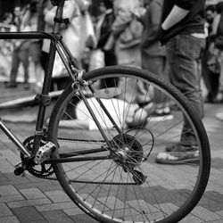 Cropped image of bicycle on footpath