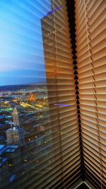 Low angle view of illuminated building against sky