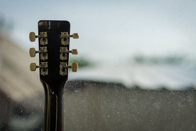 Close-up of wet glass window during rainy season