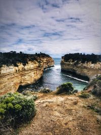 Scenic view of river and landscape against sky