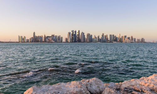 Sea with city in background