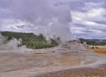 Scenic view of landscape against cloudy sky