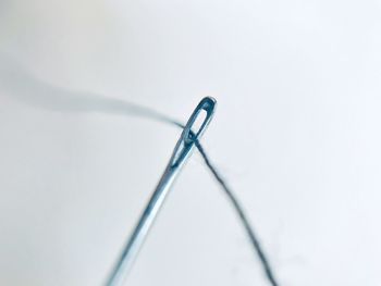 Close-up of crane on table against white background