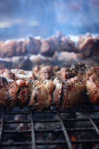 Close-up of meat on barbecue grill