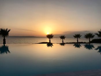 Scenic view of sea against sky at sunset