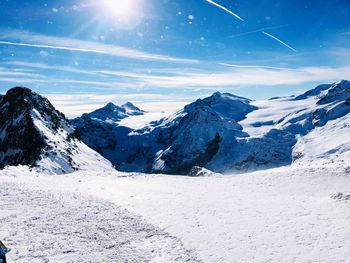 Scenic view of snowcapped mountains against sky