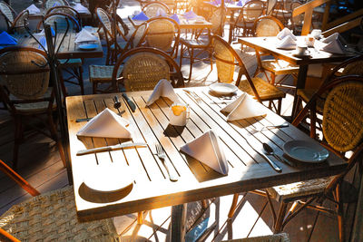 High angle view of empty chairs and tables in restaurant