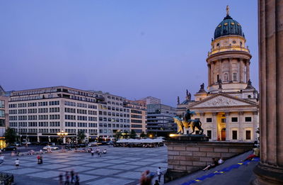 Buildings in city at dusk