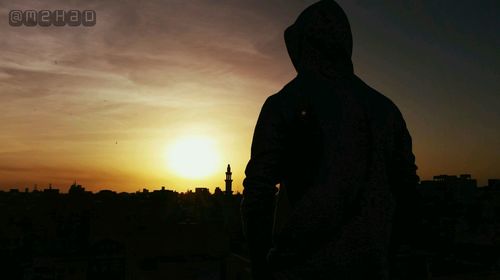 Silhouette of man against sky during sunset