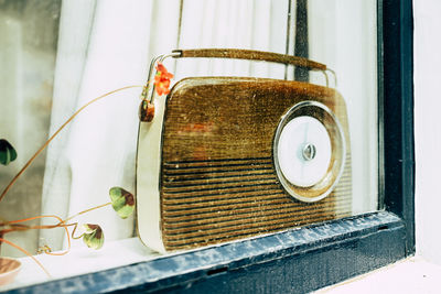 Vintage radio behind window