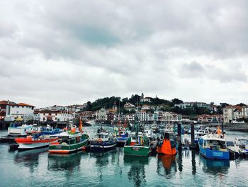 Boats moored at harbor