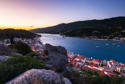 High angle view of buildings by sea against sky