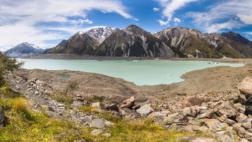 Scenic view of lake and mountains against sky