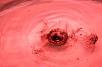 Full frame shot of pink water with red drop