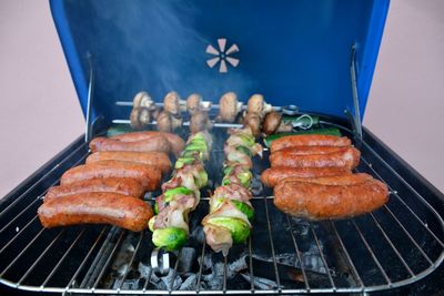 High angle view of meat on barbecue grill