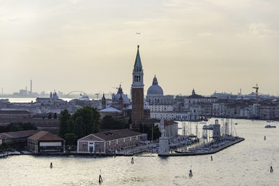 View of buildings against cloudy sky