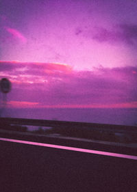 Scenic view of road against sky during sunset