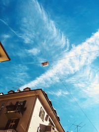 Low angle view of building against blue sky