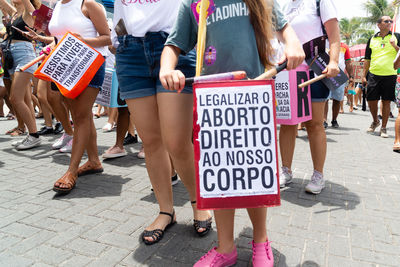 People protesting in defense of women's rights.