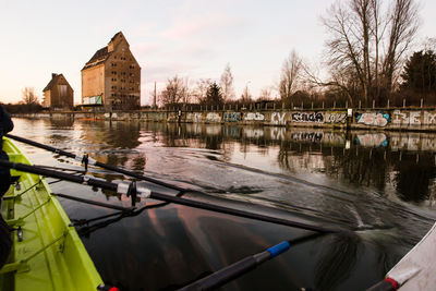 Bridge over river against sky during sunset