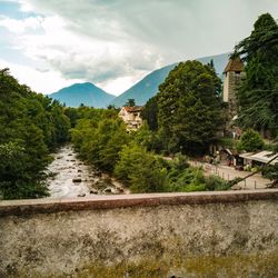 Scenic view of mountains and trees against sky