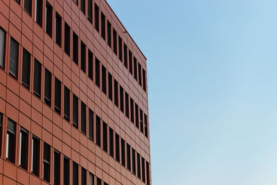 Low angle view of modern building against clear sky