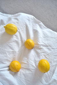High angle view of yellow fruits on bed