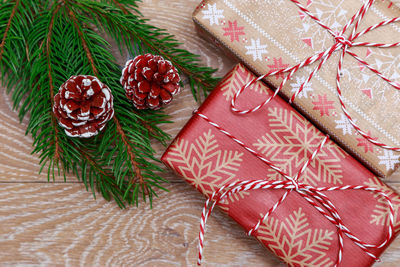 Close-up of christmas tree and gifts on table