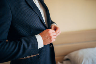 Man wearing blazer at home