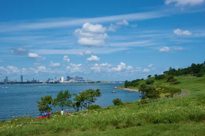 Scenic view of landscape against cloudy sky