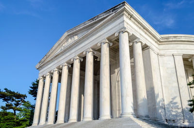 Low angle view of historical building against blue sky