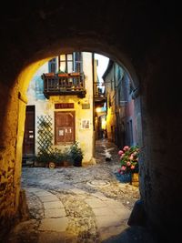 Alley amidst buildings in city