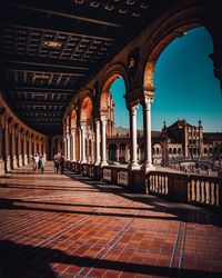 View of colonnade and buildings in city