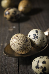 Quail eggs on a wooden table.