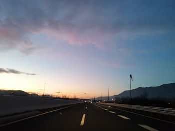 Highway against sky during sunset