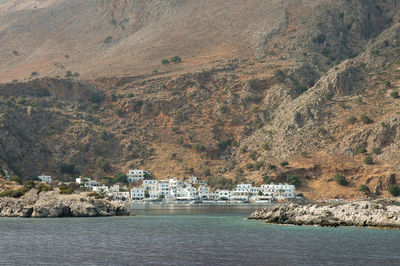 Scenic view of sea against buildings