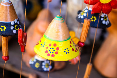 Close-up of multi colored decorations hanging for sale in market