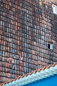 Low angle view of brick wall