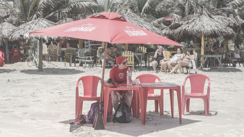 Empty chairs on beach