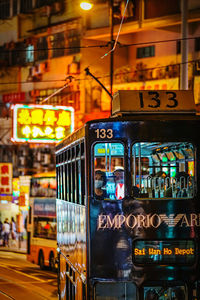 Graffiti on illuminated city street at night