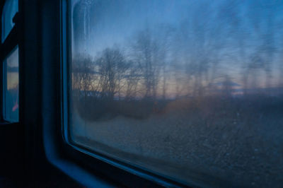 Reflection of train on glass window