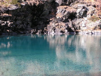 Scenic view of rock formations in water