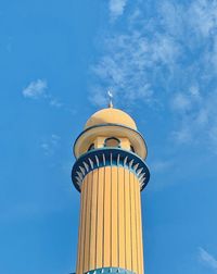 Low angle view of mosque tower against sky
