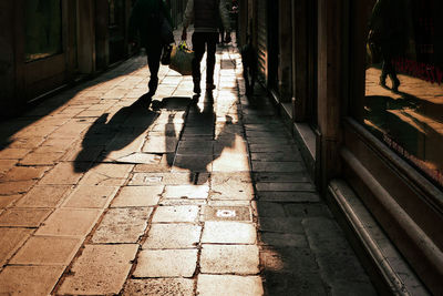 Low section of people walking on footpath