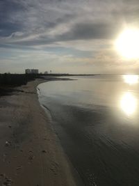 Scenic view of beach against sky during sunset