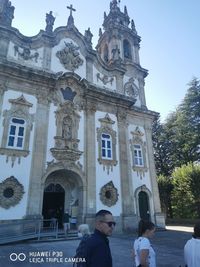 People in front of historic building